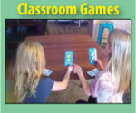 Two girls playing a game together at a table.